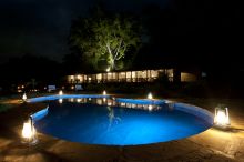 The pool illuminated at night at The Emakoko, Nairobi National Park, Nairobi, Kenya