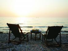 Watching the sunset from beach chairs at Gombe Forest Lodge, Gombe National Park, Tanzania